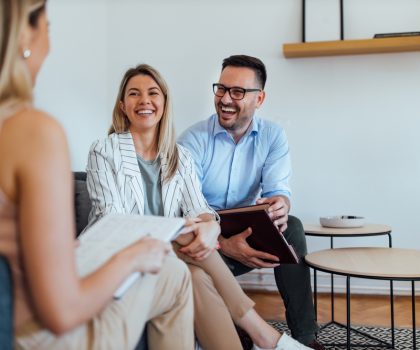 Three,Business,People,Having,Fun,On,A,Meeting,,Portrait.