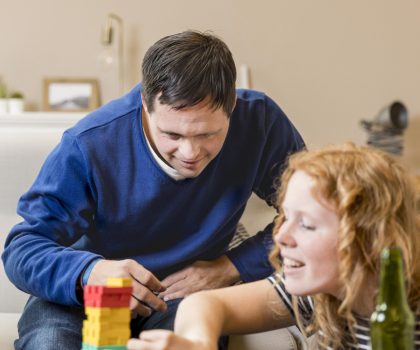 man-woman-playing-games-home-while-having-beer